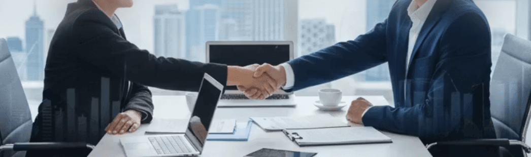 Business professionals shaking hands